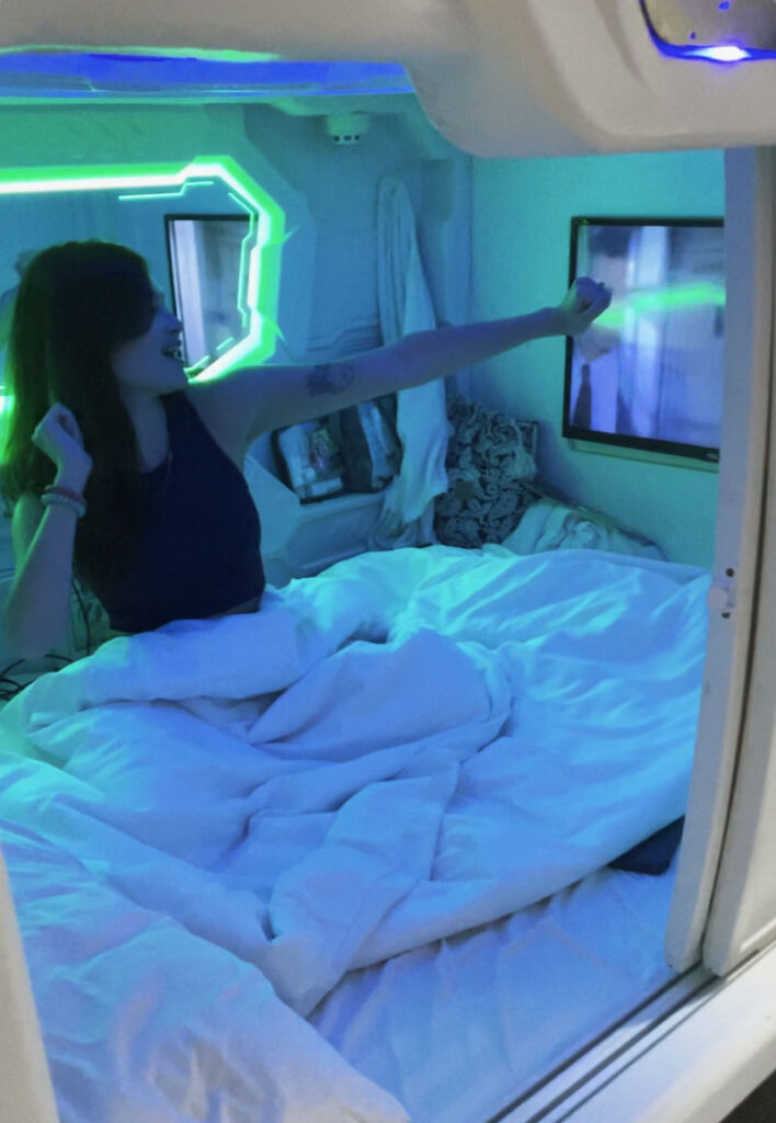 Melissa inside Met A Space Pod catching a vibe!